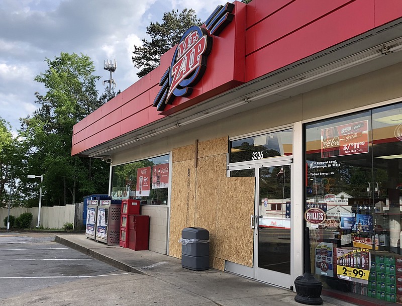 The outside of Mr. Zip Shell gas station is seen Sunday, May 6, 2018, some hours after a group of burglars used a van to crash into it's wall in an attempt to steal an ATM machine.