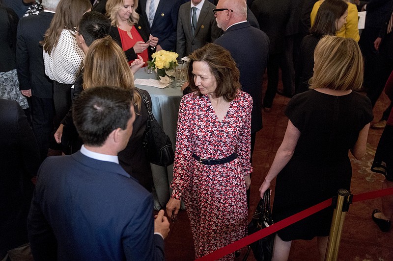 In this May 2, 2018, photo, CIA Director-nominee Gina Haspel attends the ceremonial swearing in for Secretary of State Mike Pompeo at the State Department in Washington. Haspel is telling senators that she would stand firm against restarting the spy agency's brutal interrogation program of terrorist suspects. Two administration officials said May 4 that Haspel is saying that if confirmed, she would be against resurrecting the program even though Trump has supported waterboarding and worse.(AP Photo/Andrew Harnik)