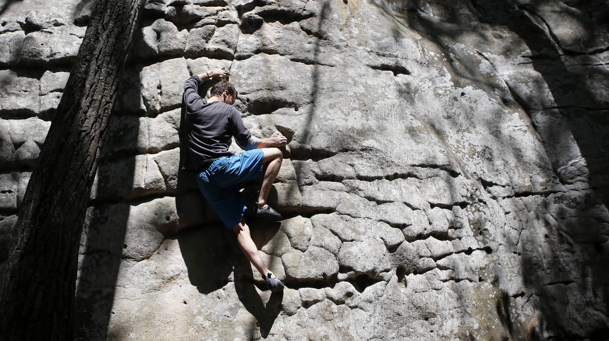 Forrest Gaskin makes his way up a boulder at Stone Fort, also known as Little Rock City, on Sunday, May 6, 2018 in Soddy-Daisy, Tenn. To coincide with the opening of their new Chattanooga store on May 18, REI sponsored a weekend of outdoor activities including free entrance to Stone Fort/Little Rock City.