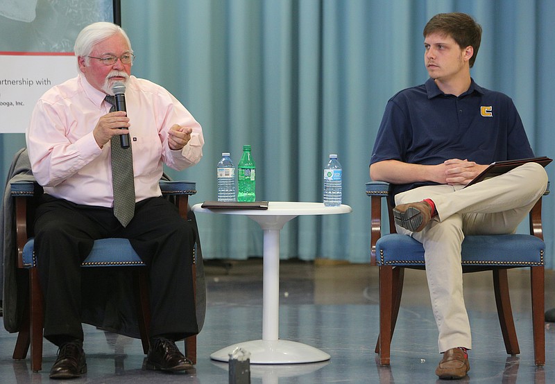 David Testerman, incumbent, introduces himself as Tucker McClendon looks on during a debate at East Ridge Elementary School Monday, May 8, 2018 in East Ridge, Tenn. UnifiEd was hosting the first of a series of debates between Hamilton County school board candidates Monday night.