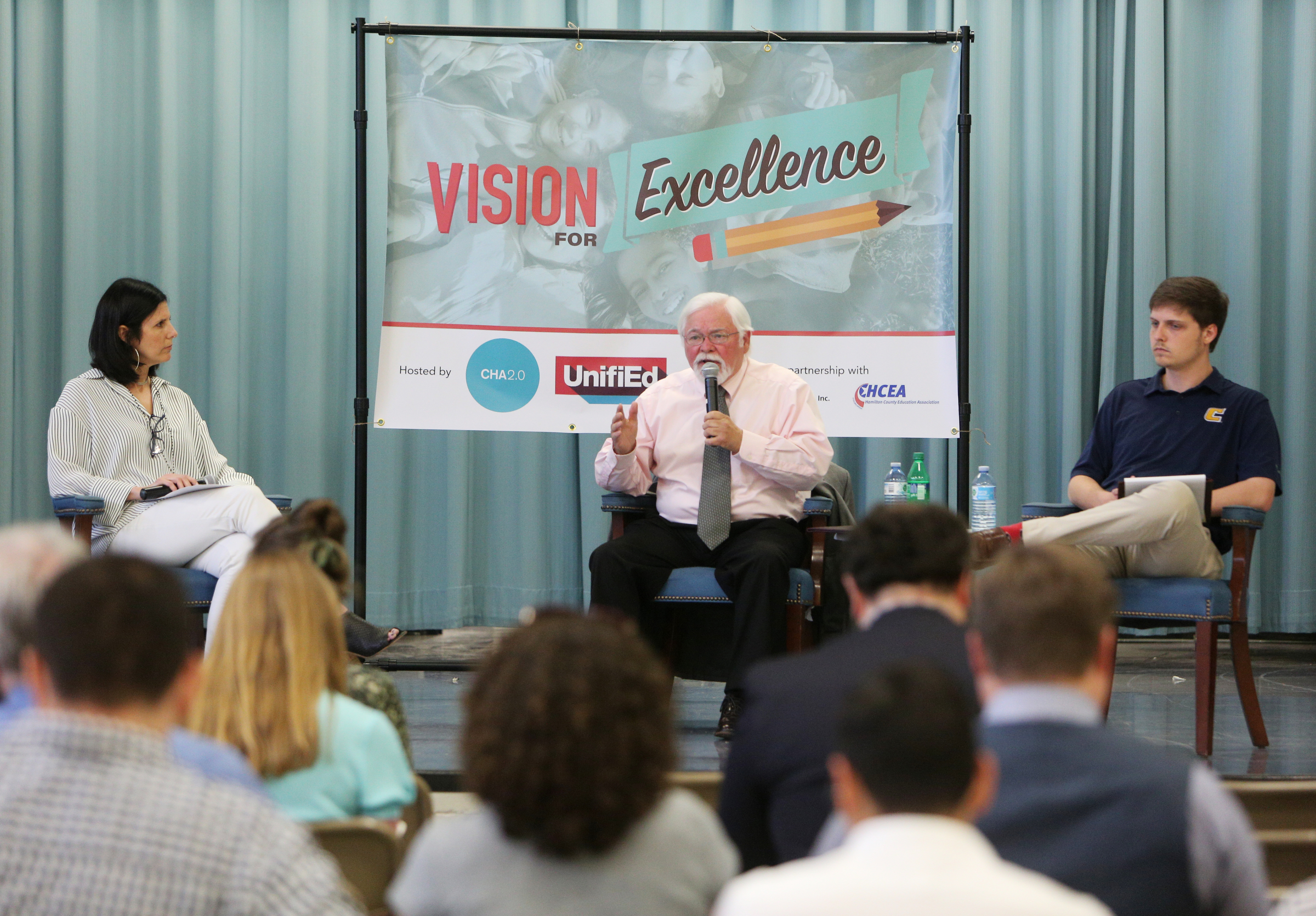 David Testerman, incumbent, introduces himself as the moderator Alison Lebovitz and Testerman's opponent Tucker McClendon looks on during a debate at East Ridge Elementary School Monday, May 8, 2018 in East Ridge, Tenn. UnifiEd was hosting the first of a series of debates between Hamilton County school board candidates Monday night.
