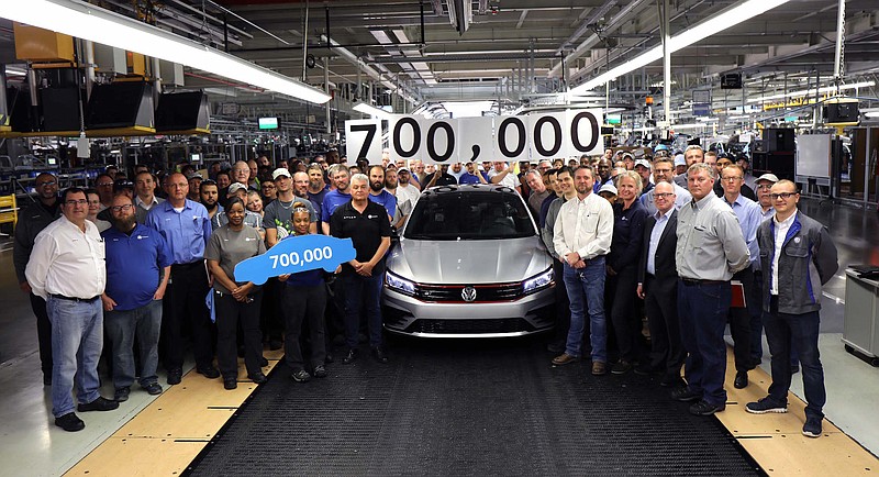 Employees at the Volkswagen assembly plant in Chattanooga celebrate production of the 700,000th VW Passat to be made since production began of the U.S. version of the vehicle in 2011.