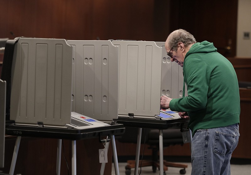 In this Friday, April 27, 2018 photo, a voter prepares his ballot during early voting at the Hamilton County Government Center in Noblesville, Ind. The U.S. Department of Homeland Security is facing a backlog of requests for comprehensive cybersecurity reviews of state election systems. Among those still waiting is Indiana, which is one of four states with primaries on Tuesday, May 8, 2018. (AP Photo/Michael Conroy)