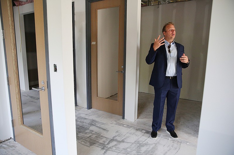 Jon Pirtle, chief executive officer of E/SPACES, shows off some of the mid-sized office spaces in E/SPACES Wednesday, May 2, 2018 in Chattanooga, Tenn. E/SPACES offers a variety of offices as well as meeting rooms and larger common spaces. 