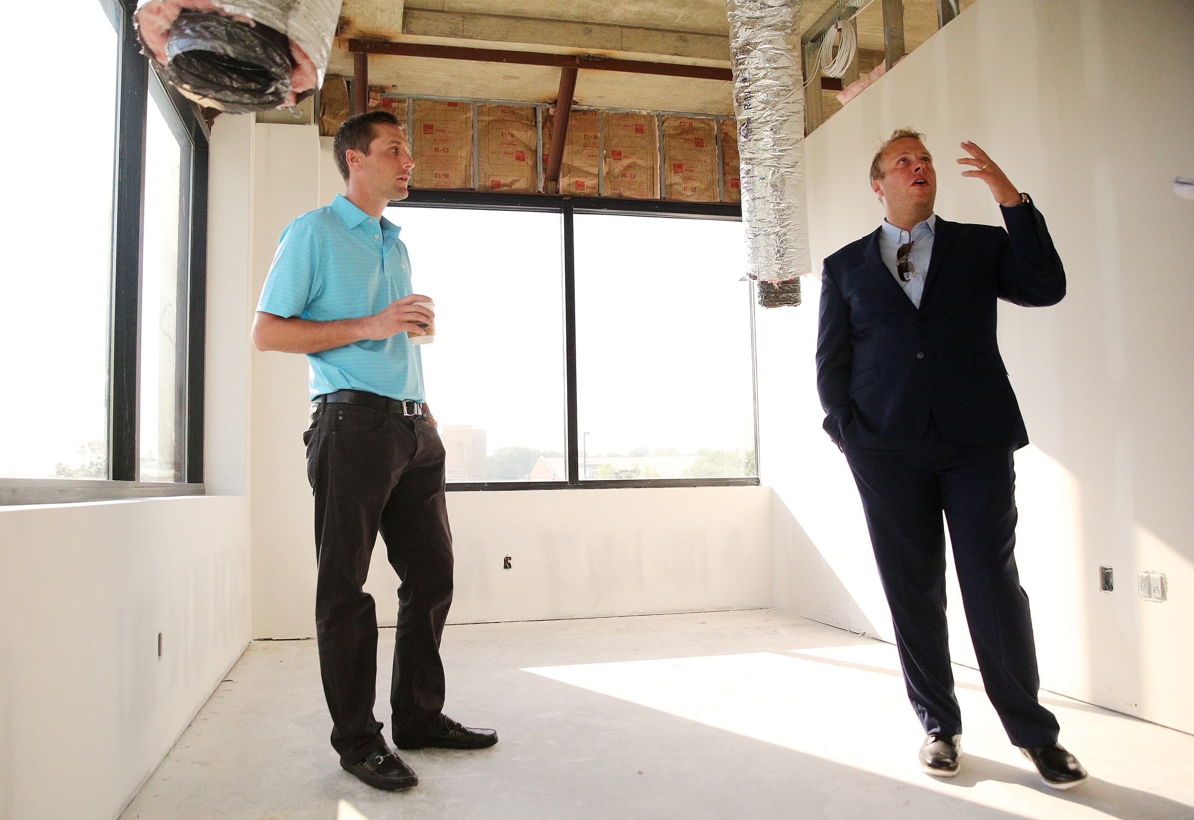 Derek Rende, vice president of sales, and Jon Pirtle, chief executive officer of E/SPACES, show off one of the larger offices in E/SPACES Wednesday, May 2, 2018 in Chattanooga, Tenn. E/SPACES is located on the second floor inside University Tower on 4th Street.