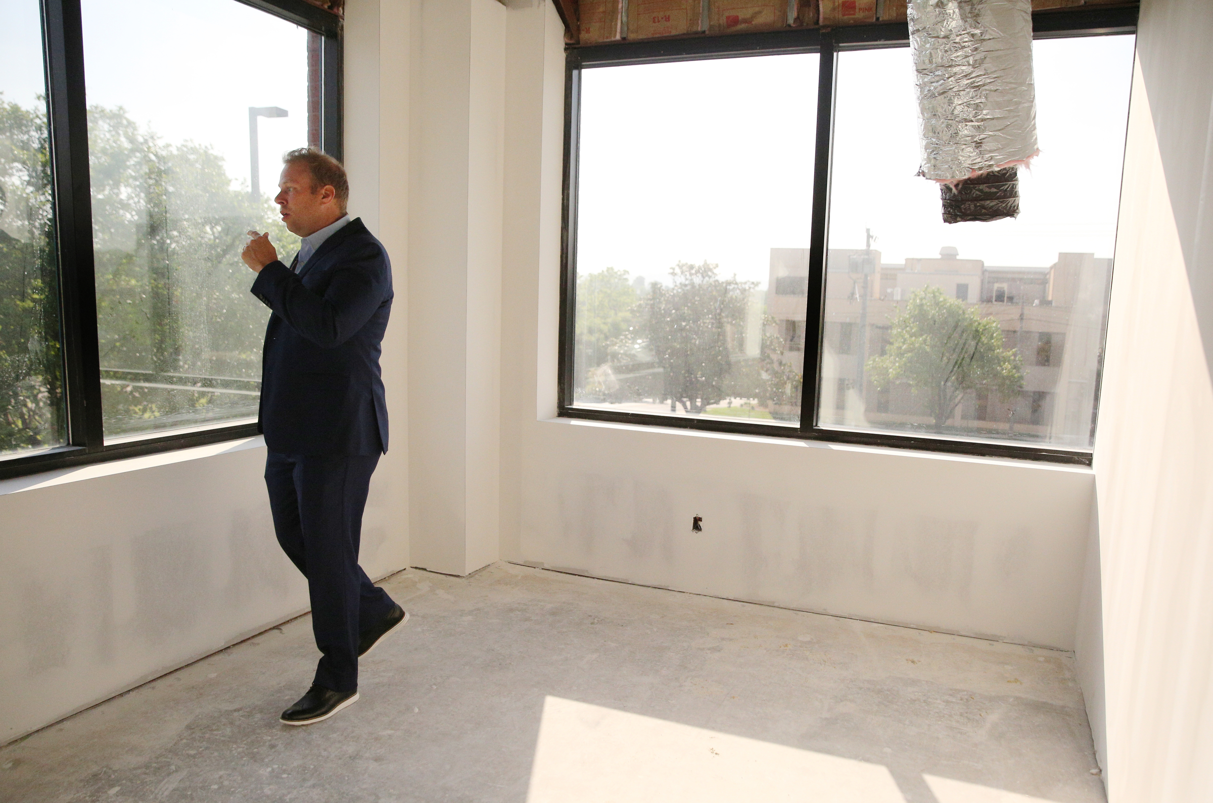 Jon Pirtle, chief executive officer of E/SPACES, shows off one of the larger offices in E/SPACES Wednesday, May 2, 2018 in Chattanooga, Tenn. Rooms can be rented on an hourly or monthly basis.