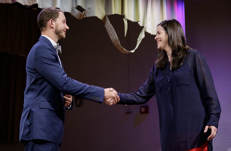 Hamilton County School Board District 6 candidates Michael Henry, left, and Jenny Hill shake hands before a debate hosted by UnifiEd at Lookout Valley High School on Tuesday, May 8, 2018, in Chattanooga, Tenn. Incumbent board member Joe Galloway is not seeking re-election.