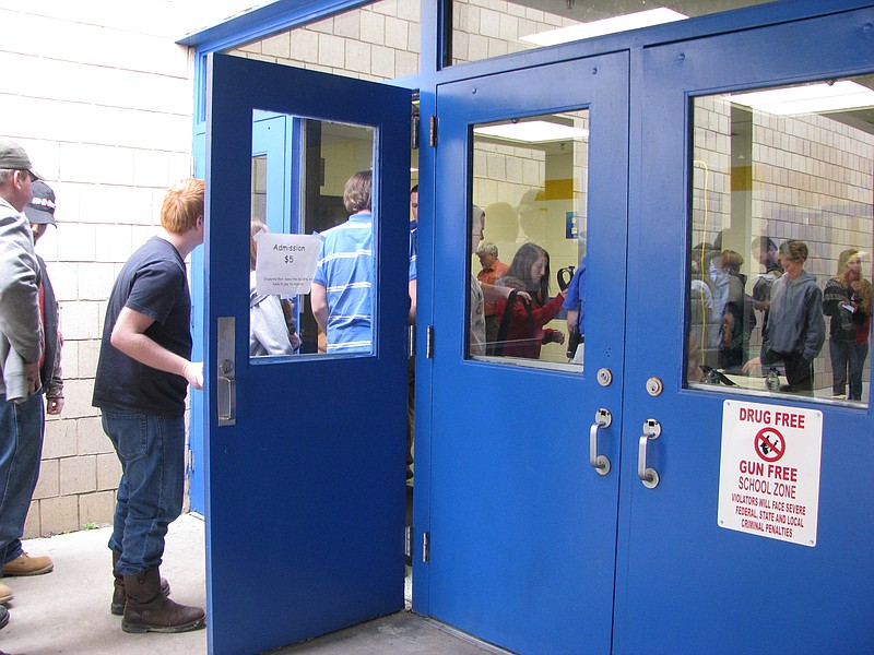 Bledsoe County High School students wait to enter the school.