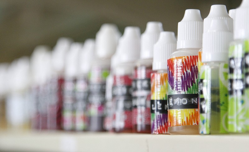 Ashley Hartman looks through new flavors of vaping liquid while at Sweet Creek Vapors in East Ridge in this 2014 file photo.