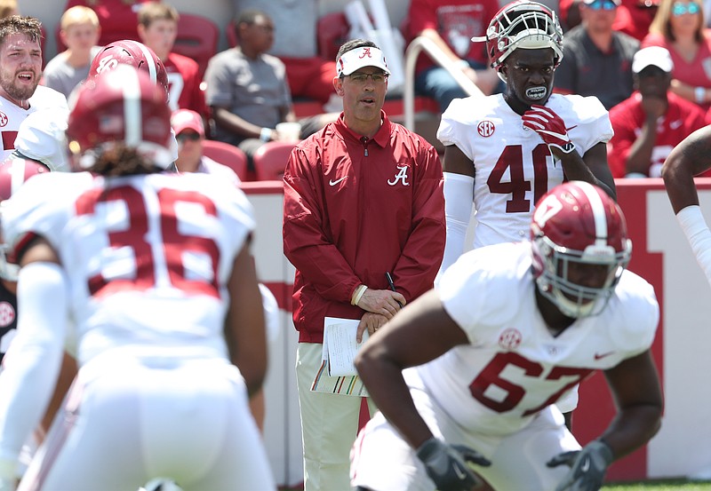 Alabama first-year quarterbacks coach Dan Enos, shown here at last month's A-Day spring game, will earn more from his Arkansas buyout in 2018 than from his new employer.