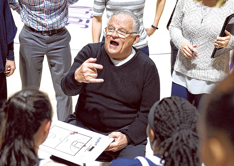 UTC women's basketball head coach Jim Foster instructs his team in the huddle. The University of Tennessee Mocs visited the Western Carolina Catamounts in Southern Conference women's basketball action at the Ramsey Center in Cullowhee, North Carolina on February 1, 2018