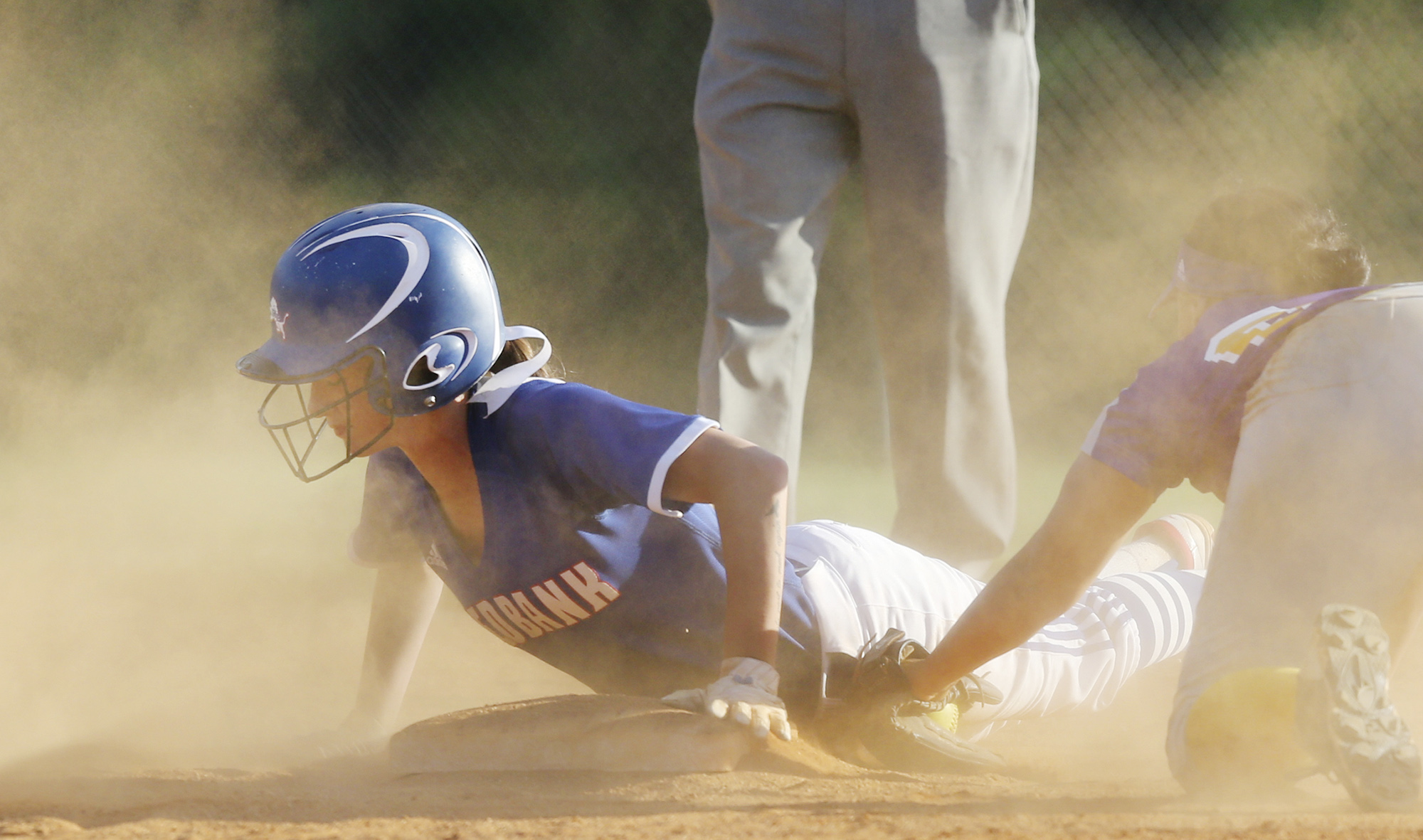 Red Bank's Destiny Painter safely dives into second base on a steal as Chattanooga Central shortstop Janara Smith attempts to tag her out on a throw down during the District 6-AA softball championship game between Red Bank and Chattanooga Central Tuesday, May 8, 2018 in Signal Mountain, Tenn.