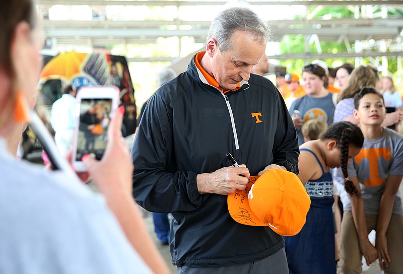 University of Tennessee basketball coach Rick Barnes signs autographs for Vols fans during the Big Orange Caravan Thursday, May 10, 2018 at the Tennessee Pavilion in Chattanooga, Tenn. The Big Orange Caravan made its annual Chattanooga stop, and athletic director Phillip Fulmer, head football coach Jeremy Pruitt, basketball coach Rick Barnes, women's basketball coach Holly Warlick and others were in attendance to speak and sign autographs.