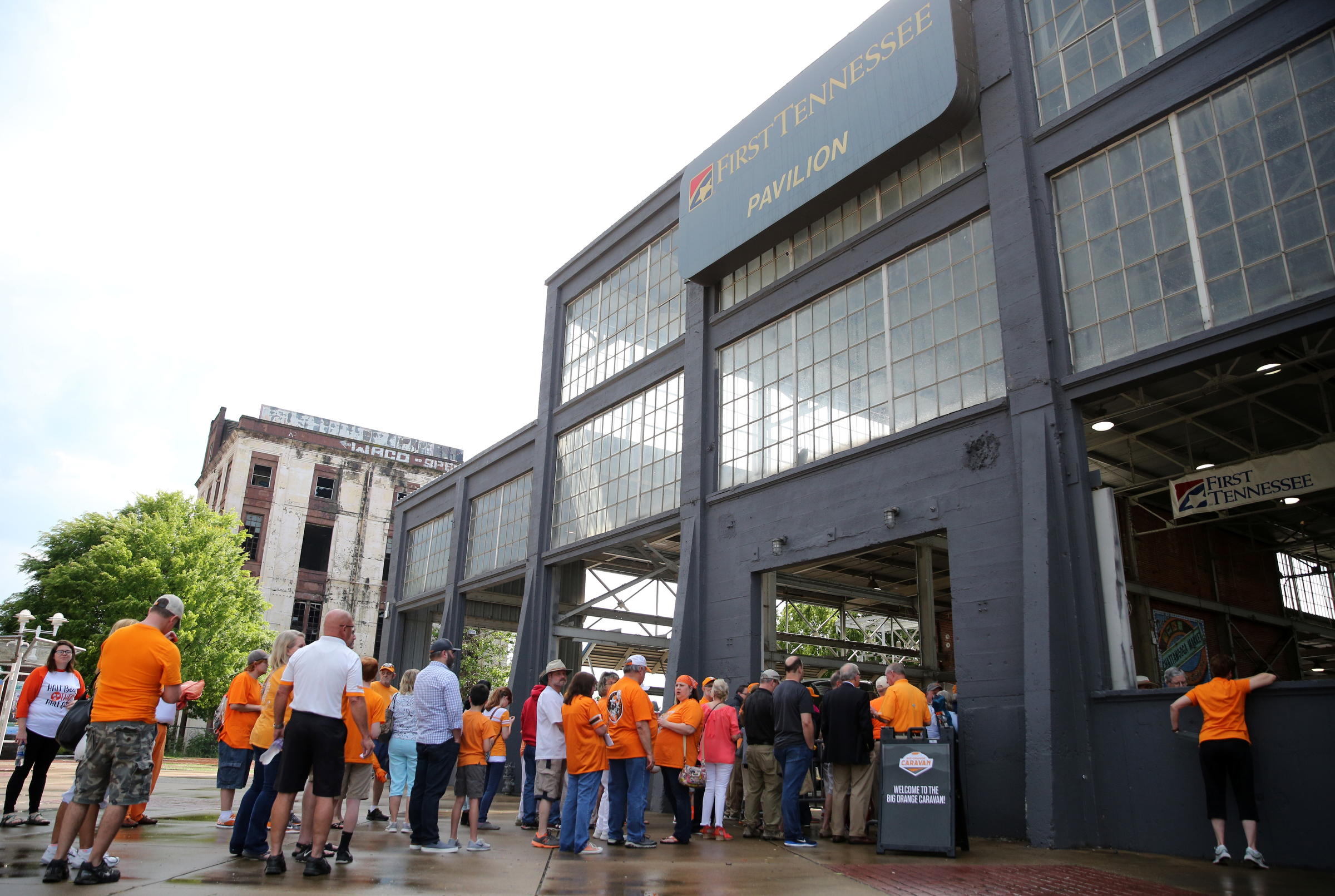 Fans line up for to be let into the Tennessee Pavilion before the Big Orange Caravan event Thursday, May 10, 2018 in Chattanooga, Tenn. A few hundred Vols fans made their way to the Tennessee Pavilion to get autographs from coaches and hear them speak.