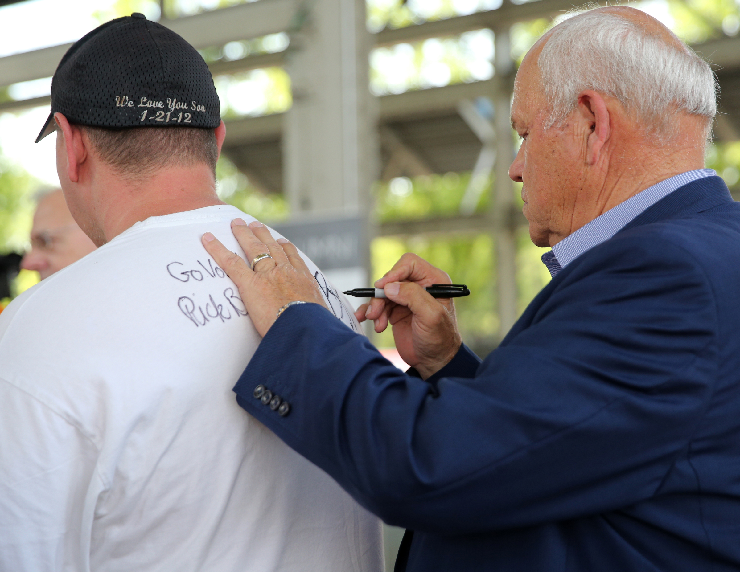 Chris Galyon gets his shirt signed by University of Tennessee athletic director Phillip Fulmer during the Big Orange Caravan Thursday, May 10, 2018 at the Tennessee Pavilion in Chattanooga, Tenn. A few hundred Vols fans made their way to the Tennessee Pavilion to get autographs from coaches and hear them speak.