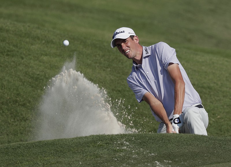 Chesson Hadley hits from a bunker on the ninth hole, during the first round of The Players Championship golf tournament Thursday, May 10, 2018, in Ponte Vedra Beach, Fla. (AP Photo/John Raoux)