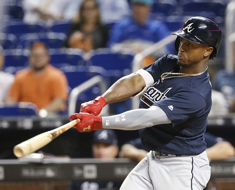 Atlanta Braves' Ozzie Albies hits a grand slam during the sixth inning of the team's baseball game against the Miami Marlins, Thursday, May 10, 2018, in Miami. (AP Photo/Wilfredo Lee)