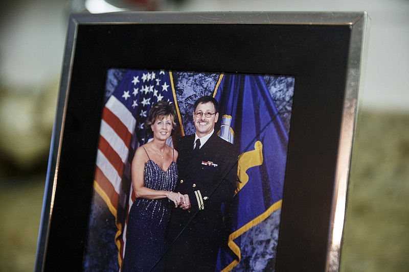 A framed photo of Diana Parkinson and her husband Mark is displayed at her home on Wednesday, March 7, 2018, in Rossville, Ga. Mark was shot through the window and killed by an unseen Walker County Sheriff's deputy on the night of Jan. 1 after he walked into his kitchen with a handgun in response to his barking dogs, his wife says.