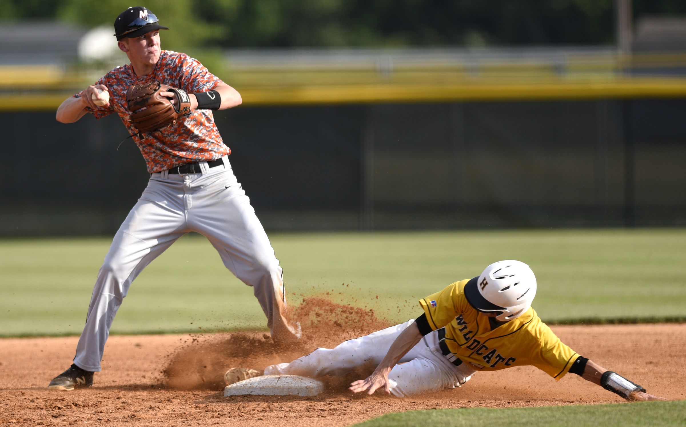 Meigs second baseman, Aaron Johnson (7) forces Hixson's Alex Rollins (2) at second in a attempt for a double play. The Hixson runner was safe at first. The Meigs County Tigers visited the Hixson Wildcats in the TSSAA Region 3-AA baseball final on May 14, 2018.