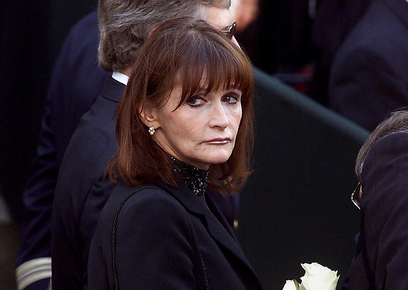 In this Oct. 3, 2000, file photo, actress Margot Kidder, who dated former Prime Minister Pierre Trudeau, arrives for his funeral at Notre-Dame Basilica in Montreal, Quebec. Kidder, who starred as Lois Lane in the "Superman" film franchise of the late 1970s and early 1980s, has died. Franzen-Davis Funeral Home in Livingston, Montana posted a notice on its website saying Kidder died Sunday, May 13, 2918, at her home there. She was 69. (Adrian Wyld/The Canadian Press via AP)