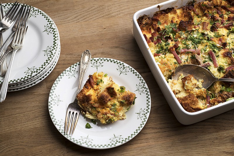 A savory bread pudding is shown in New York, April 23, 2018. The "custard" in this breakfast pudding has no sugar, just a dash of black pepper, a pinch of cayenne, half-and-half and a few eggs. (Karsten Moran/The New York Times)