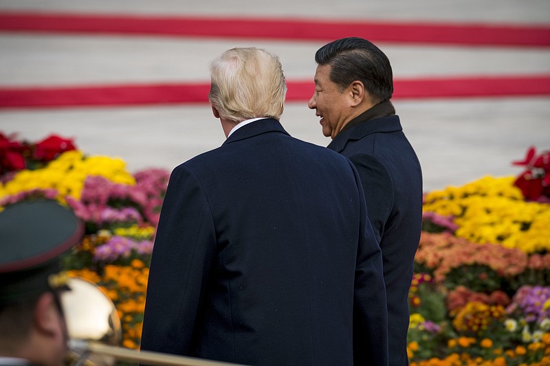 President Donald Trump and President Xi Jinping of China during a welcome ceremony for the U.S. president's visit in Beijing, Nov. 9, 2017. Trump tweeted on Sunday, May 13, 2018, that he was working with his Chinese counterpart to prevent the collapse of Chinese electronics giant ZTE, which shut down major operations after being sanctioned by the U.S. Department of Commerce last month. (Photo by Doug Mills/The New York Times) 