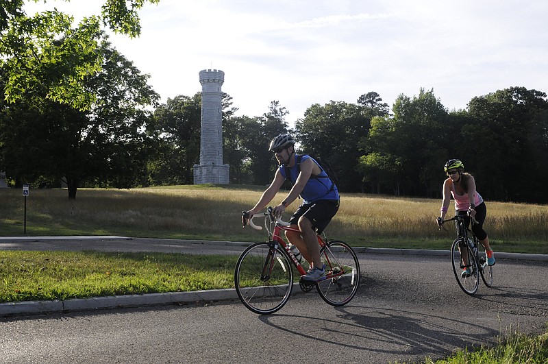 Bikers in Chickamauga Battlefield pass Wilder Tower on their ride. Outdoor Chattanooga and battlefield staff have partnered to resume the free summer series of bike tours through the battlefield on the third Saturday of the month from May to October. (Staff photo by Tim Barber)