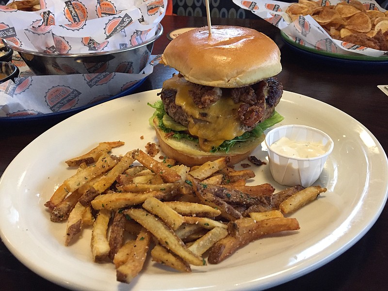 The Bad Ass Burger is topped with housemade American cheese, buttermilk-fried bacon, horseradish mayo, lettuce, tomato and pickles. For an upcharge, you can get a side of truffle fries, which come with a truffle aioli for dipping.