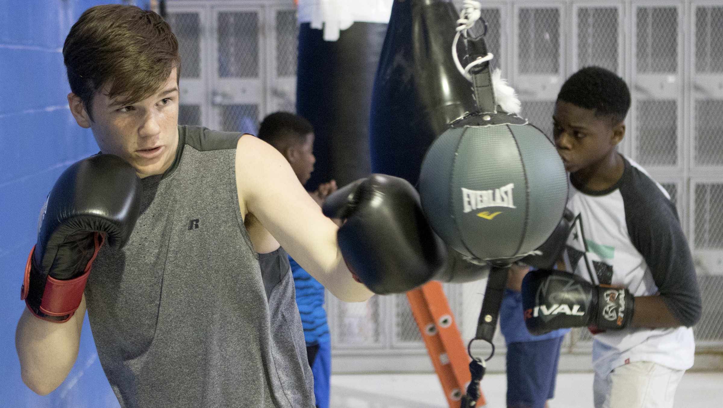 Fourteen-year-olds Riley Dearing, left, and Artell Adams, right, warm up at the Westside boxing gym on Monday, May 14, 2018 in Chattanooga, Tenn.