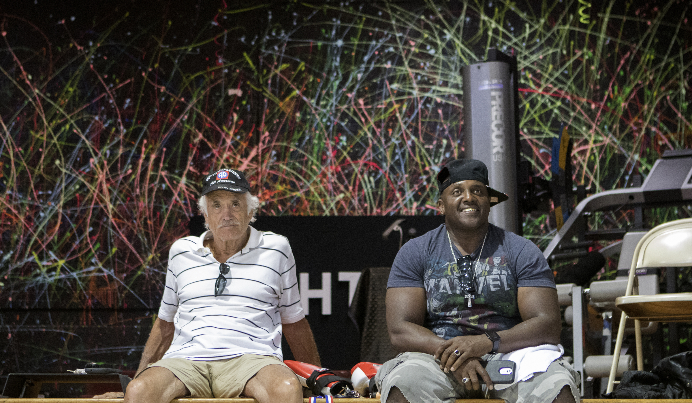 John Disterdick, left, and Kenny Mac Sr. watch as boxers go through warmups in the ring at the Westside boxing gym on Monday, May 14, 2018 in Chattanooga, Tenn.