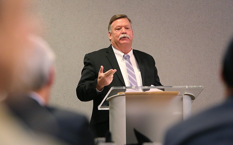 Hamilton County Mayor Jim Coppinger invites a speaker to the podium during a legislative breakfast on Jan. 4, 2018 at the Doubletree Hotel.