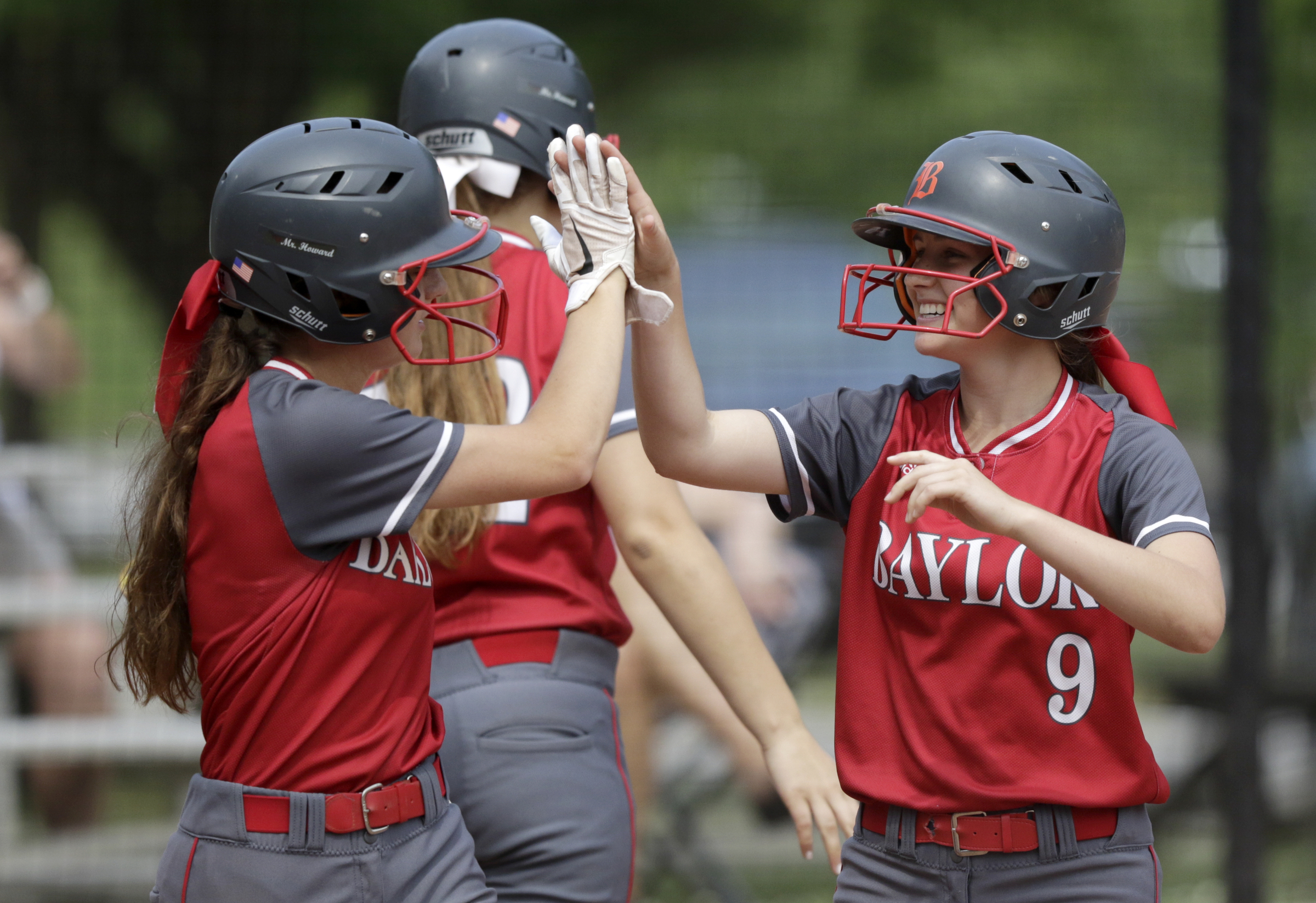 Baylor's Emily Rye (8) and Britt Barton (9) high five after scoring against St. Agnes during the first game of the Division II-AA state quarterfinals at Baylor School on Tuesday, May 15, 2018 in Chattanooga, Tenn.