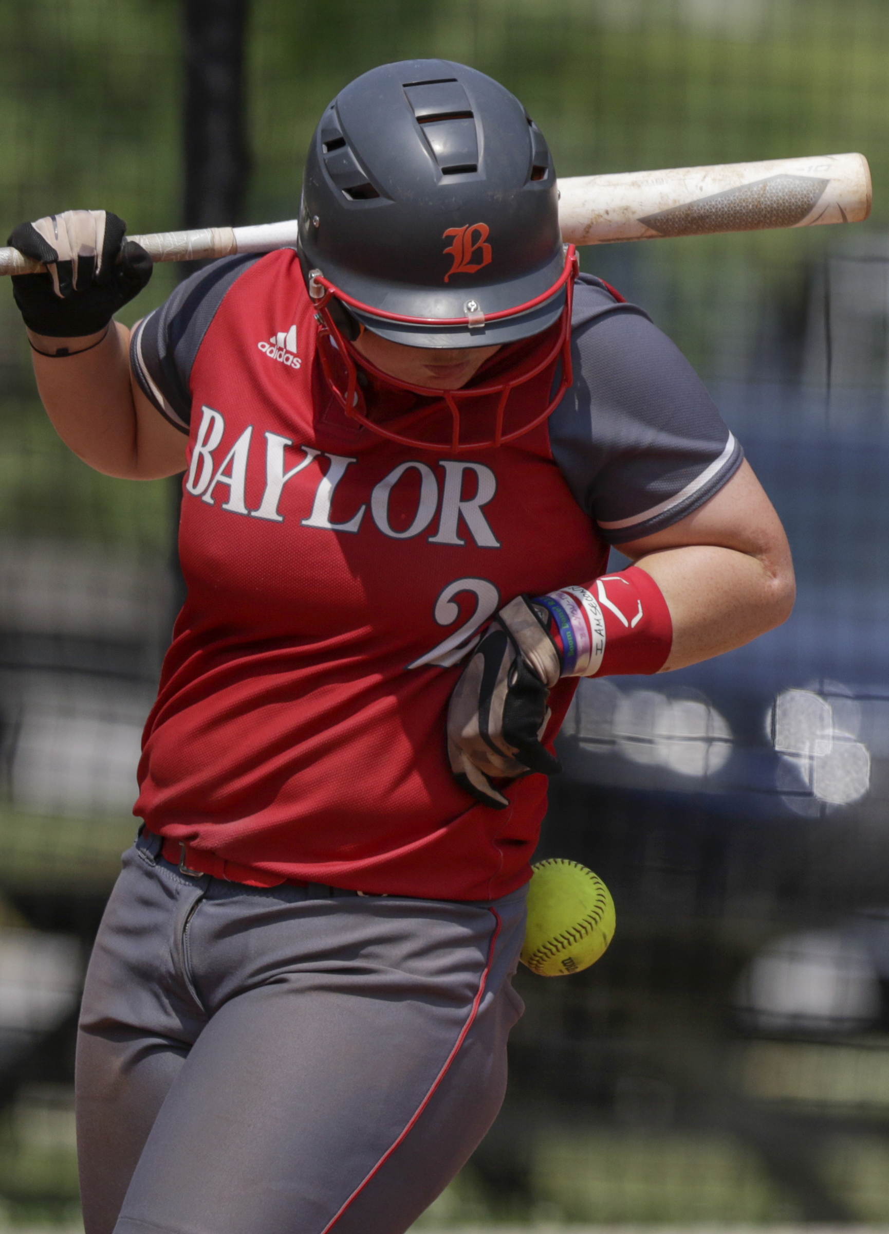 Baylor's Kamrie Rich is hit by a pitch against St. Agnes during the first game of the Division II-AA state quarterfinals at Baylor School on Tuesday, May 15, 2018 in Chattanooga, Tenn.