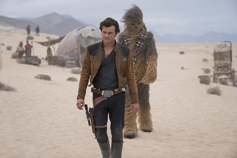 This image released by Lucasfilm shows Alden Ehrenreich and Joonas Suotamo in a scene from "Solo: A Star Wars Story." (Jonathan Olley/Lucasfilm via AP)