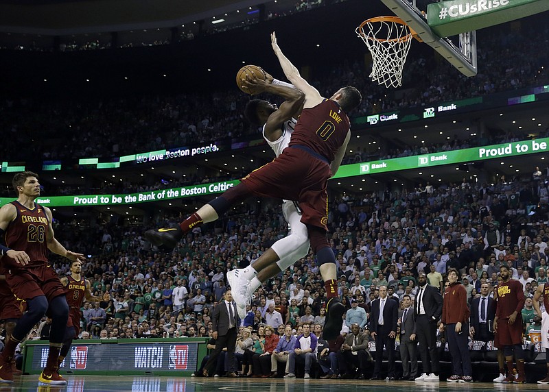 Boston Celtics guard Jaylen Brown, rear, drives against the defense of Cleveland Cavaliers center Kevin Love during the second half in Game 2 of the NBA basketball Eastern Conference finals, Tuesday, May 15, 2018, in Boston. (AP Photo/Charles Krupa)