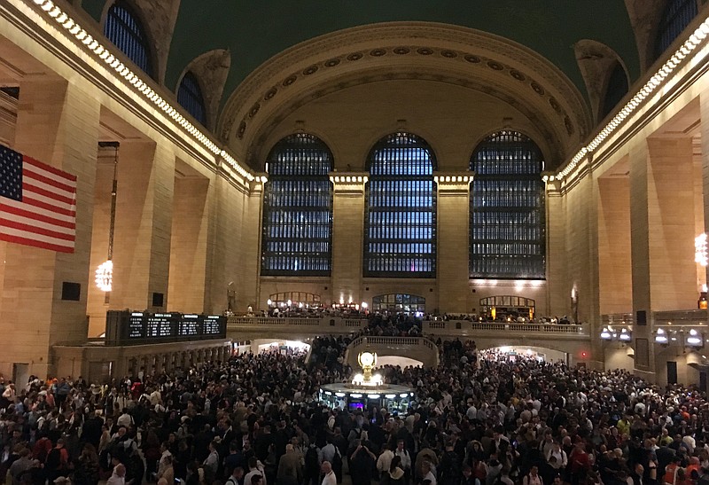 
              Commuters are stranded in Grand Central Terminal during the evening commute, Tuesday, May 15, 2018, in New York. The Metro-North commuter railroad said Tuesday evening that downed trees across the tracks had caused it to suspend service on its Harlem, Hudson and New Haven lines. (AP Photo/Donald King
            