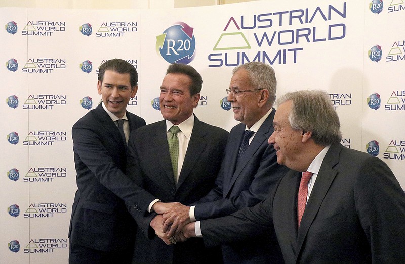 
              Austrian Chancellor Sebastian Kurz, former California Gov. Arnold Schwarzenegger, Austrian President Alexander Van der Bellen and United Nations Secretary General Antonio Guterres, from left, pose before the R20 Austrian world summit at the Hofburg palace Vienna, Austria, Tuesday, May 15, 2018. (AP Photo/Ronald Zak)
            