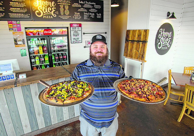 Josiah Johnson in the dining area of Home Slice Pizza, 2000 E. 23rd St. (Photo by Mark Gilliland)