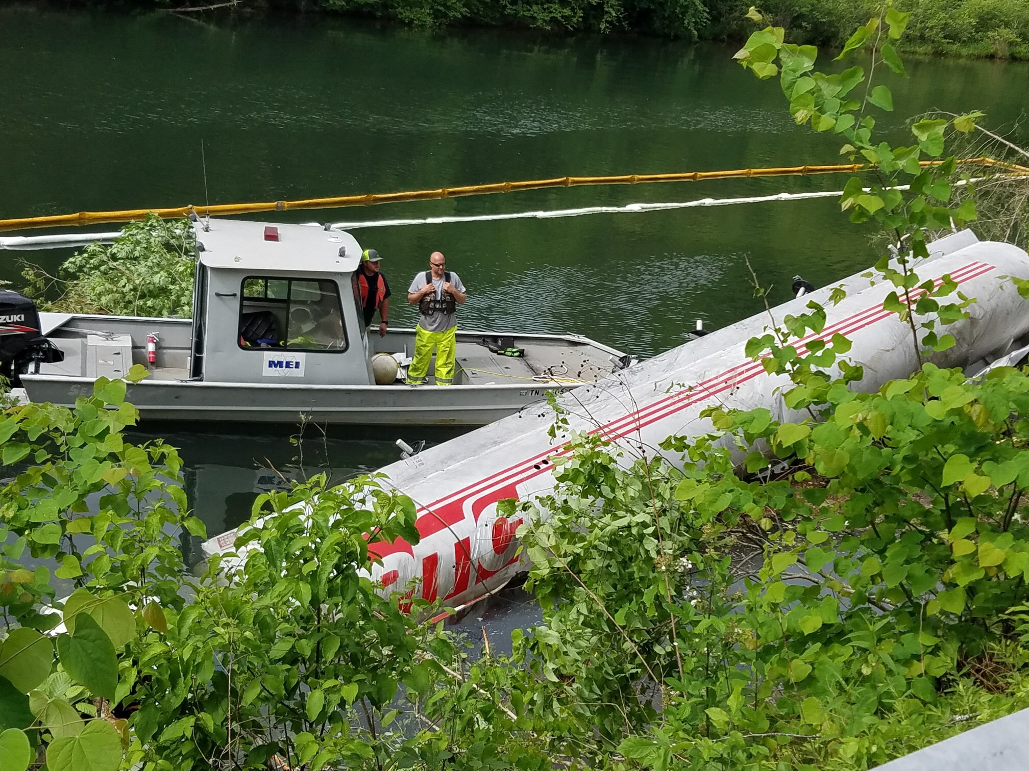 Divers are in the Ocoee River at the site of a diesel and gasoline spill after an 8,000-gallon tanker truck overturned into the water Tuesday evening on U.S. Highway 64.
(Photo by Polk County Sheriff's Office)