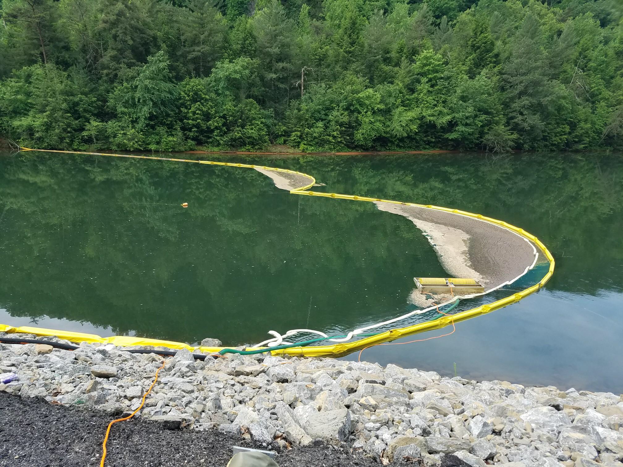 Divers are in the Ocoee River at the site of a diesel and gasoline spill after an 8,000-gallon tanker truck overturned into the water Tuesday evening on U.S. Highway 64.
(Photo by Polk County Sheriff's Office)