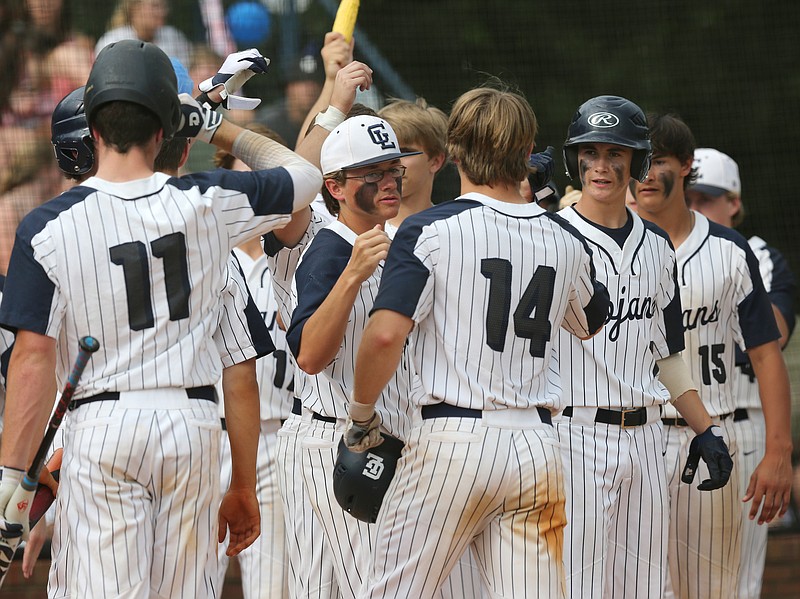 Gordon Lee's Caleb Hopkins (14) is congratulated by teammates after hitting a home run in the Trojans' doubleheader sweep of visiting Bowdon in a GHSA Class A public schools' state semifinal series. Gordon Lee won 9-0 and 5-3 to set up its title opportunity.