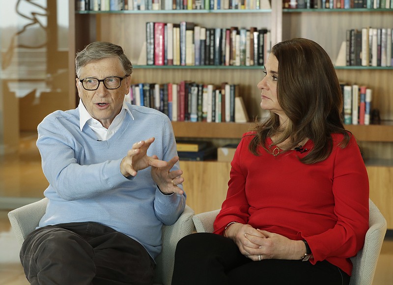 FILE - In this Feb. 1, 2018 file photo, Microsoft co-founder Bill Gates and his wife Melinda take part in an AP interview in Kirkland, Wash. Gates' non-profit Bill and Melinda Gates Foundation has given about $44 million to outside groups over the past two years to help shape new state education plans required under the 2015 law, according to an Associated Press 2018 analysis of its grants. (AP Photo/Ted S. Warren, file)