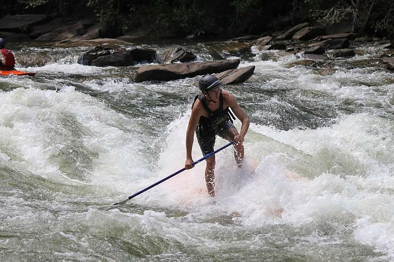 Chris Storgion, 24, braces through a rapid on the Ocoee River.