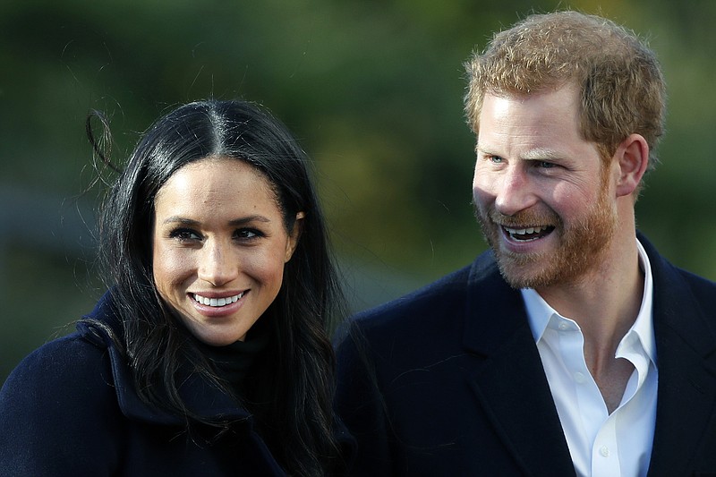 Britain's Prince Harry, right, and his fiancee Meghan Markle, in Nottingham, England. (AP Photo/Frank Augstein, FILE)