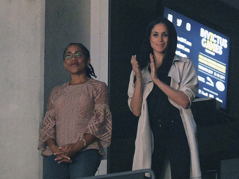 In this Saturday, Sept. 30, 2017, file photo, Meghan Markle, right, watches the closing ceremonies of the Invictus Games with her mother, Doria Ragland, in Toronto. Ragland's father, Alvin Ragland, was born in Chattanooga in 1929, according to Chattanooga Public Library records. (Nathan Denette/The Canadian Press via AP, File)