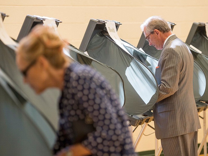 Knox County mayor candidate Bob Thomas, right, casts his vote at Deane Hill Recreational Center on Tuesday, May 1. (Photo: Brianna Paciorka/News Sentinel)