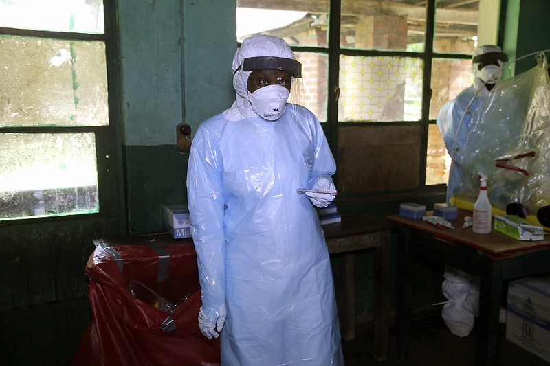 In this photo taken on Sunday, May 13, 2018, a health care worker wears virus protective gear at a treatment center in Bikoro Democratic Republic of Congo. 