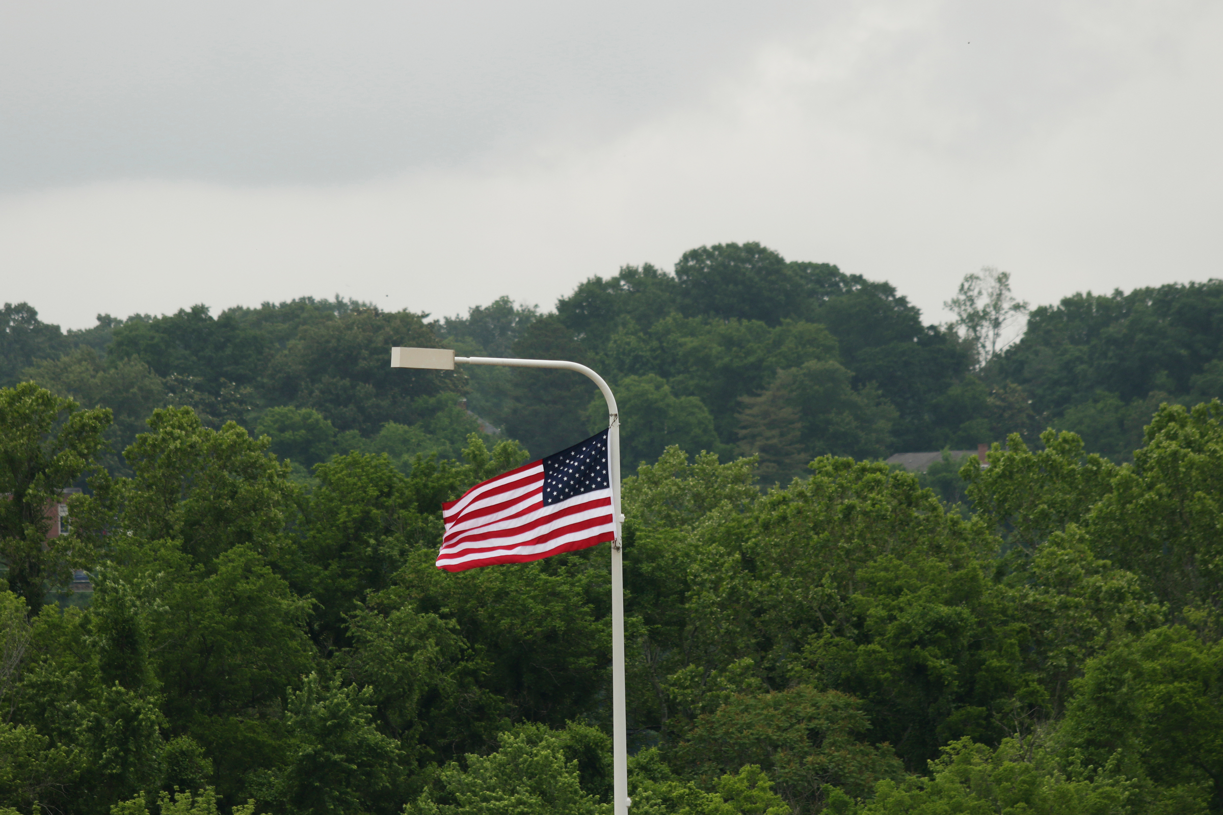 An American flag flies from a Veterans Bridge light post during the Veterans Bridge Flag Raising Ceremony on Friday, May 18, 2018, in Chattanooga, Tenn. The annual installation of new American flags on the bridge ahead of Armed Forces Day honors the city's veterans.