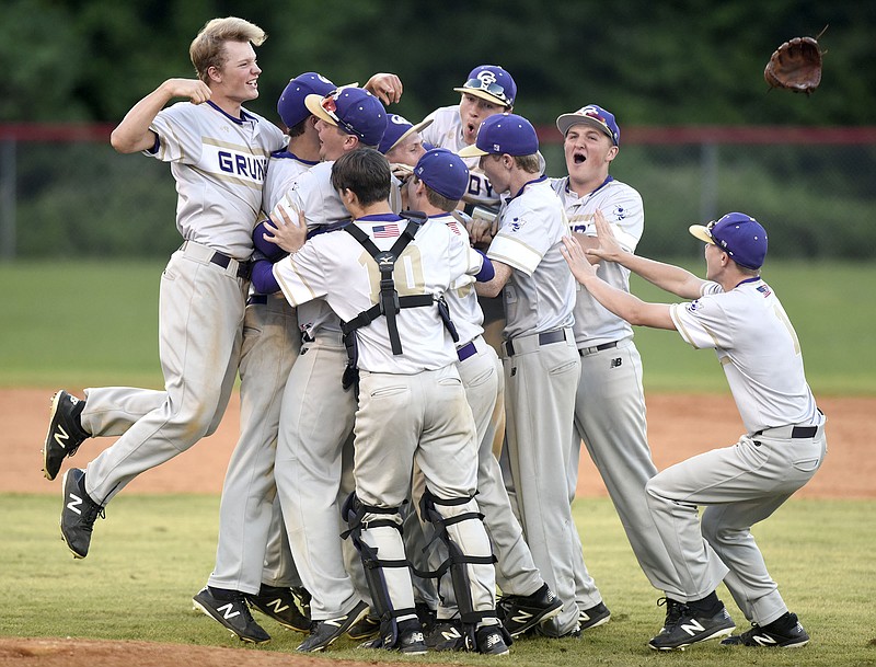 Staff Photo by Robin Rudd The Grundy County Yellow Jackets mob pitcher Blane Harris as they celebrate their 5-3 Class AA state-sectional victory over host Signal Mountain.