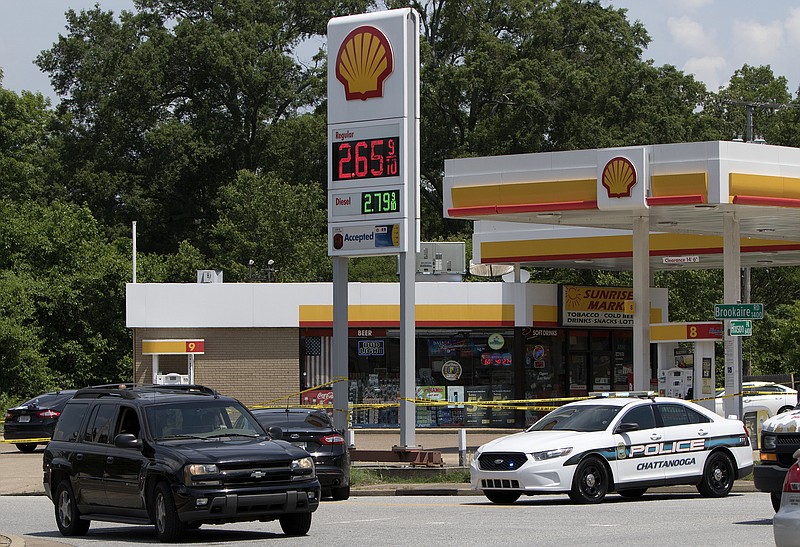 Police investigate a shooting at the Sunrise Market gas station located in the 6400 block of Hixson Pike on Sunday, May 20, 2018, in Hixson, Tenn. (Staff photo by C.B. Schmelter)
